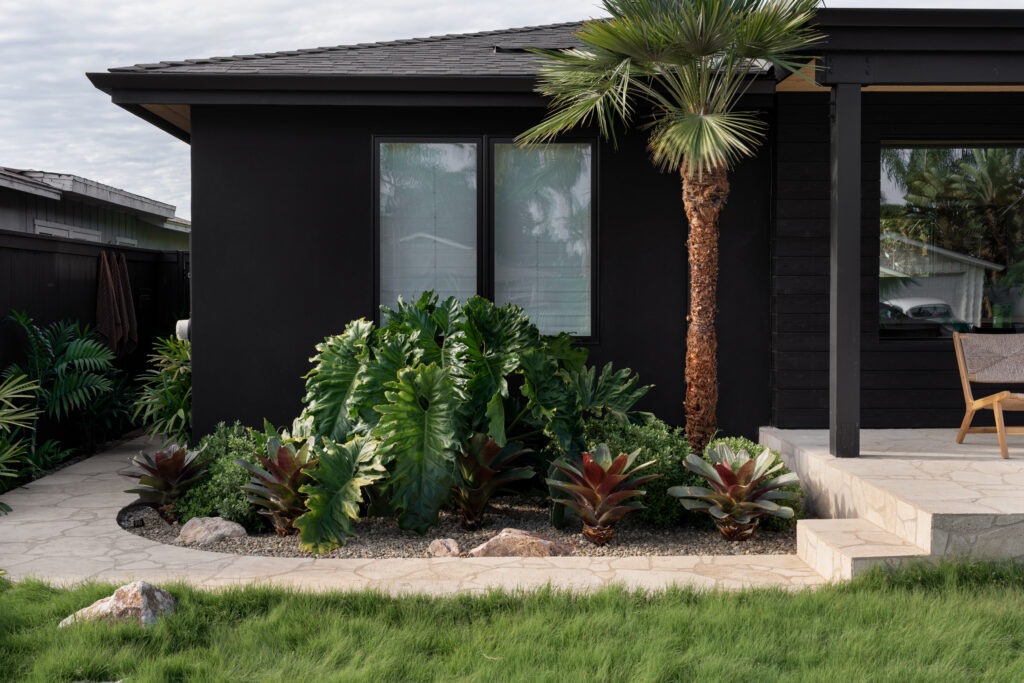 Exterior of home with refreshed coastal landscaping