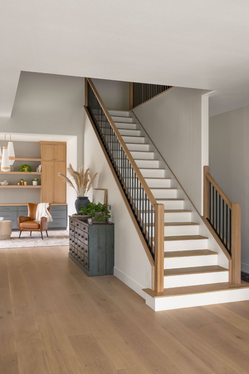 Custom built stair system with clean line and natural wood tones with custom detailing anchors