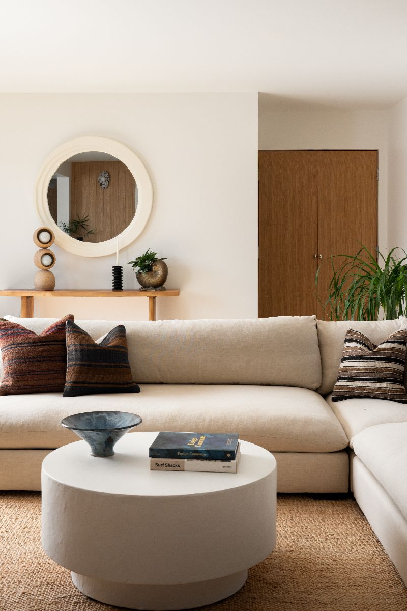 A LaCantina folding door system seamlessly connects the living room space to the outdoors
